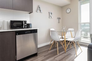 Apartamento | Área de estar | TV de tela plana 42 polegadas com canais digitais