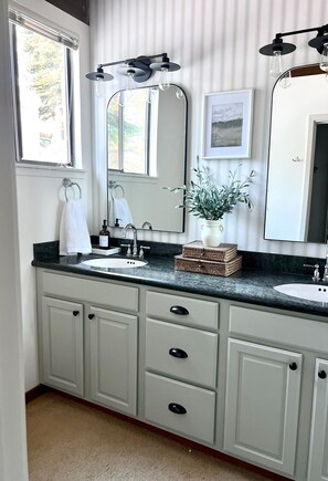 A bathroom with a double sink, a large mirror, and a potted plant on the vanity. - 5 minutes from North Star, Beautiful Large Vacation Home! (Kings Beach)