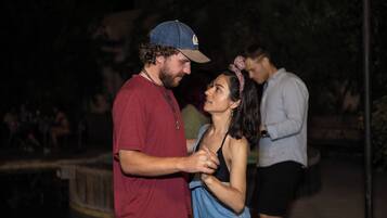A couple dancing at night.