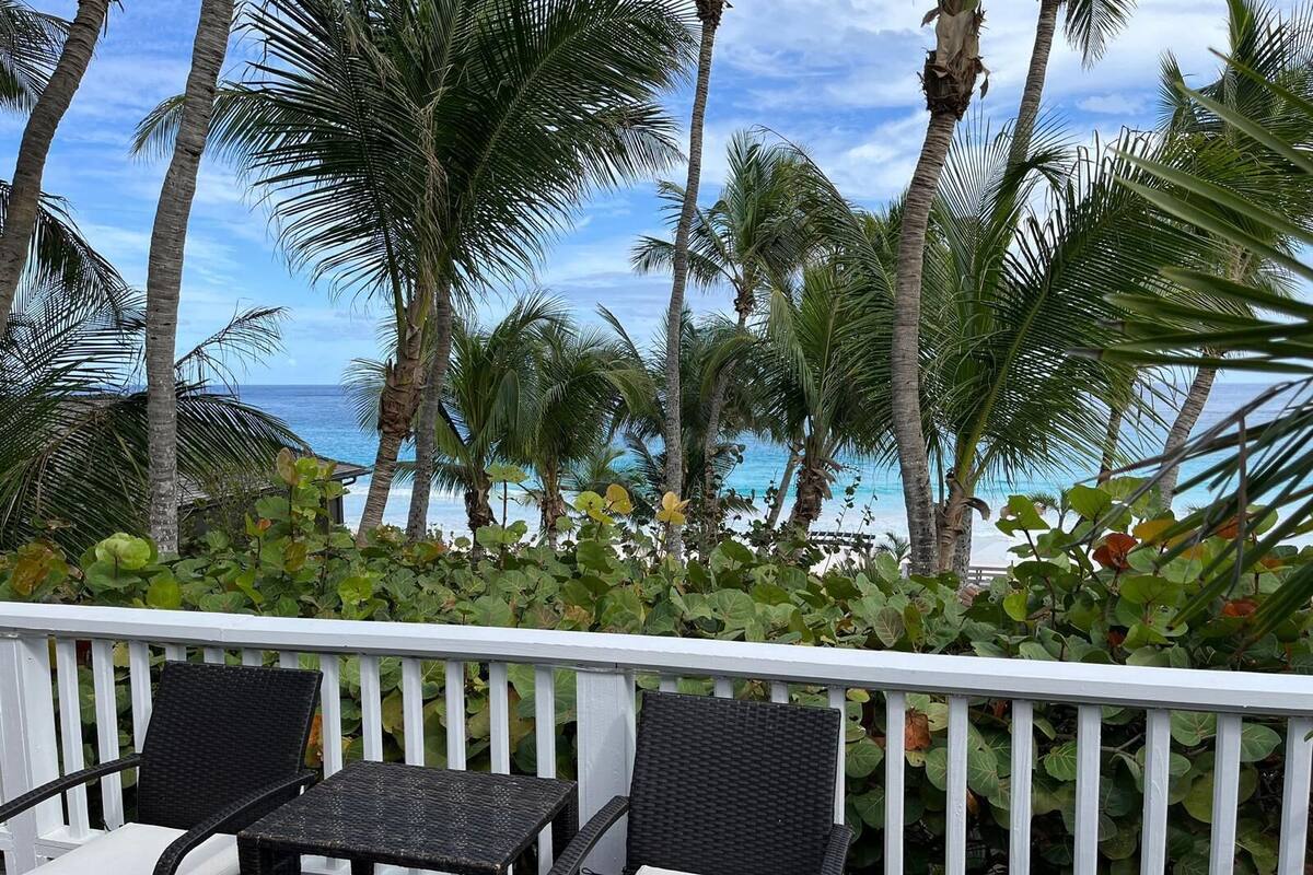 Deluxe Room, Multiple Beds, Beach View, Oceanfront | In-room safe, desk, laptop workspace, blackout drapes