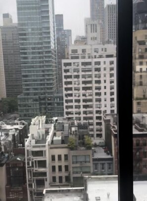 A high-rise building with multiple floors, large windows, and a modern architectural design. - Cozy 2-bedroom 2 bath in welcoming New York with fitness room, indoor pool ,  (New York)