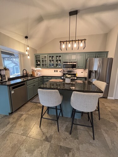 Cozy and cheerful three bedroom home with hot tub.