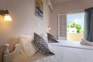 1 habitación, tabla de planchar con plancha y ropa de cama