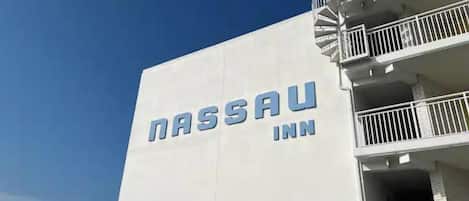 The exterior of the Nassau Inn with a clear view of its name on the building facade.
