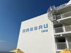 The exterior of the Nassau Inn with a clear view of its name on the building facade.