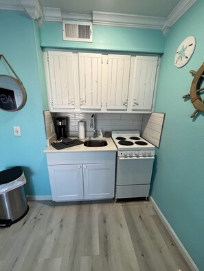 Fridge, microwave, stovetop, coffee/tea maker