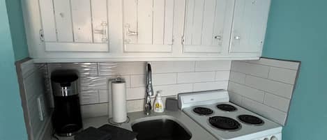 Fridge, microwave, stovetop, coffee/tea maker