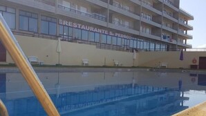 A swimming pool with a building in the background labeled "RESTAURANTE S. PEDRO". - AL.Fredos 1| Mindelo | Beachfront (Mindelo)
