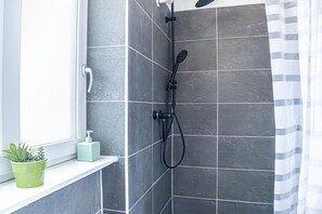 Shower, hair dryer, towels, soap