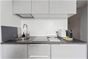 Fridge, microwave, stovetop, coffee/tea maker