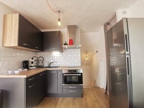 Fridge, oven, cookware/dishes/utensils