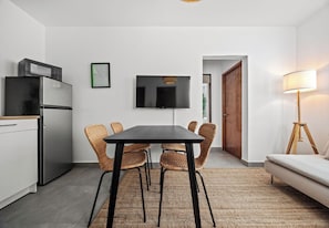 Apartment, 2 Bedrooms | Living area | 50-inch Smart TV with digital channels, books, stereo - Condado by Otium (San Juan)