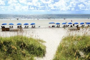 On the beach, sun-loungers