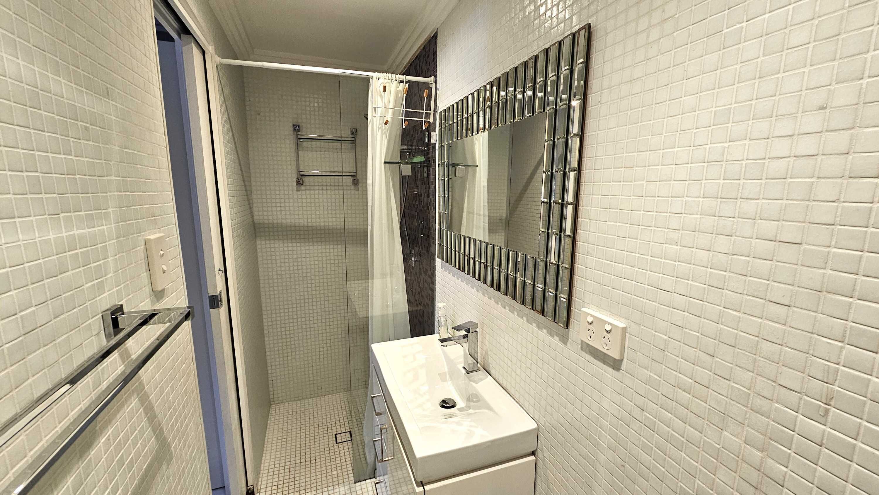 Shower, hair dryer, towels, shampoo