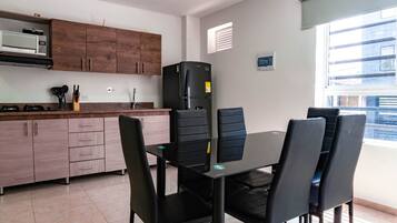 Deluxe Apartment | Private kitchen | Fridge