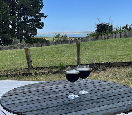 Terrace/patio. The Wee Crib with water views and PET friendly