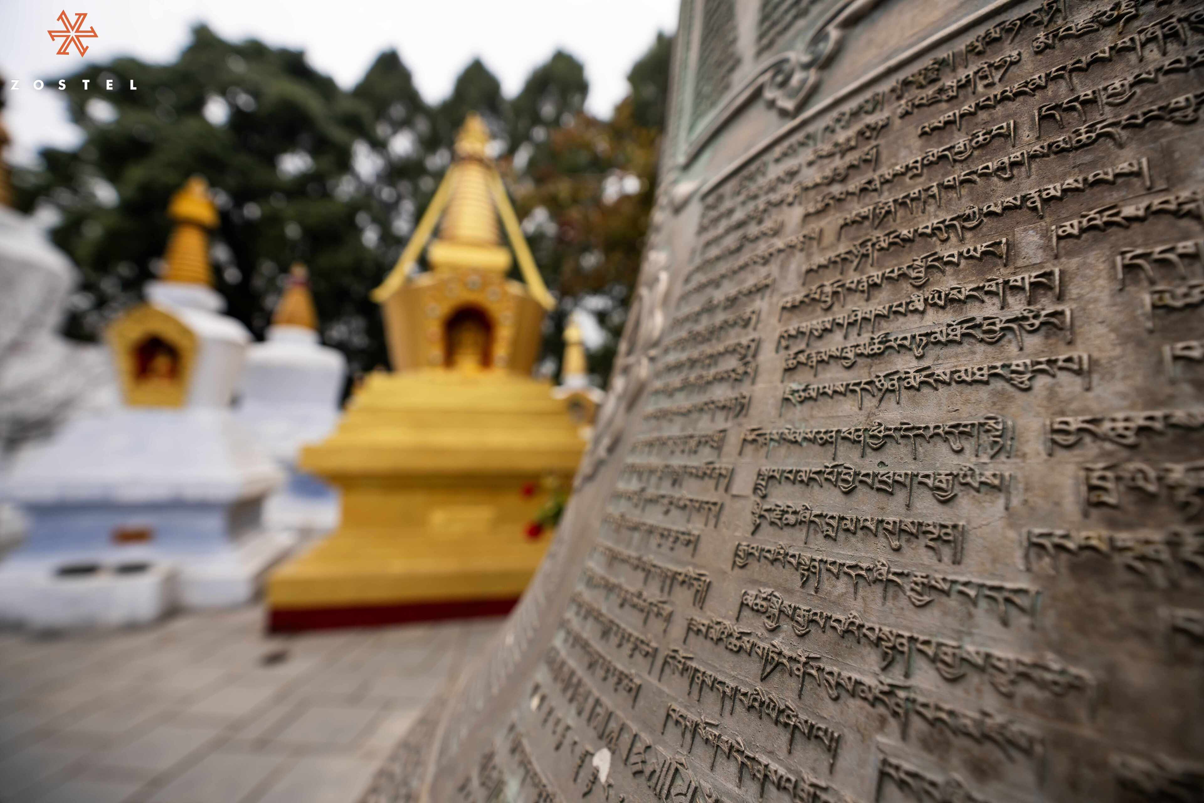 A temple with inscriptions and golden spires.