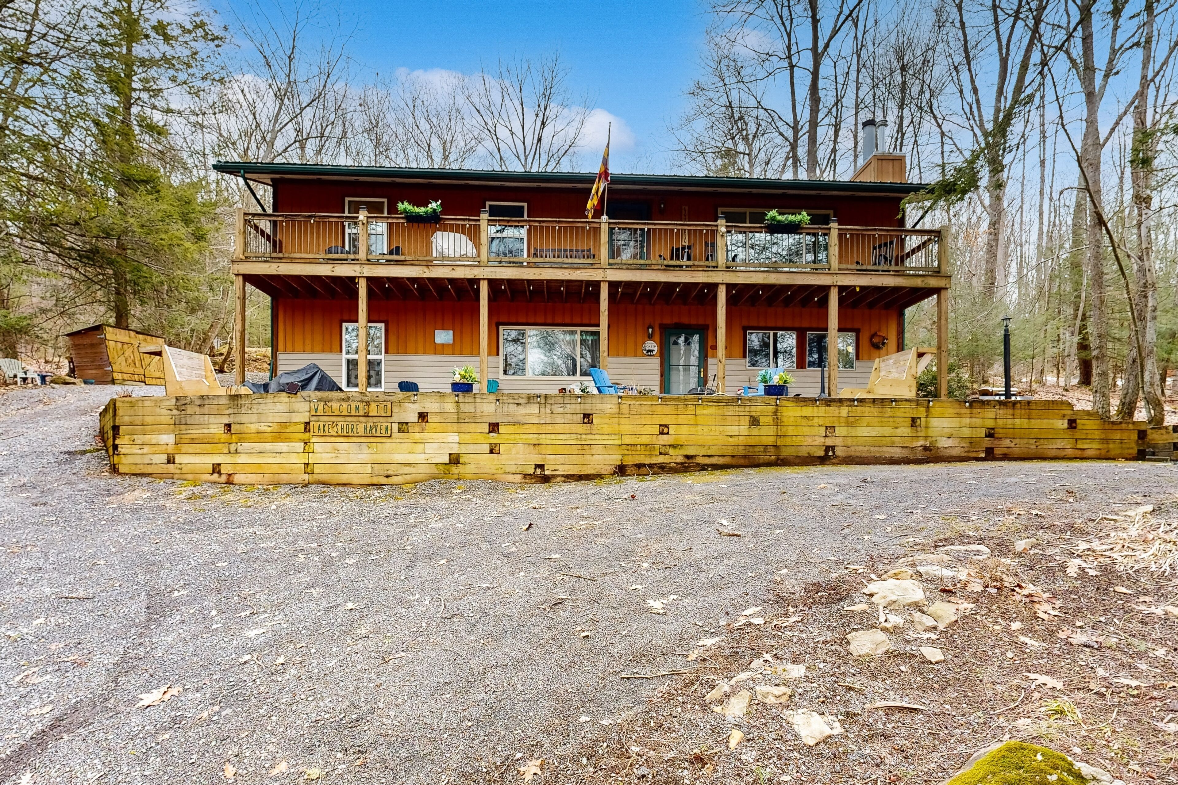 Dog-friendly lake cabin with covered porch, hot tub, pool table, grill, & firepit
