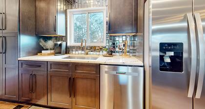 Ideally located home with enclosed yard, tiki bar, grill, smoker, & smart TVs