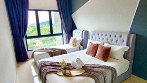 A modern bedroom with a large bed, a ceiling fan, and a view of greenery outside. - Infinity View Suites l The Horizon Ipoh l by Grab A Stay - 1-8 Pax (Ipoh)