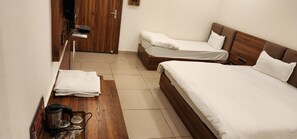 Deluxe Room | Desk, free wired Internet, bed sheets - Hotel Govindam (Ujjain)