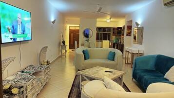 Deluxe Villa | Living area | 24-inch Smart TV with digital channels