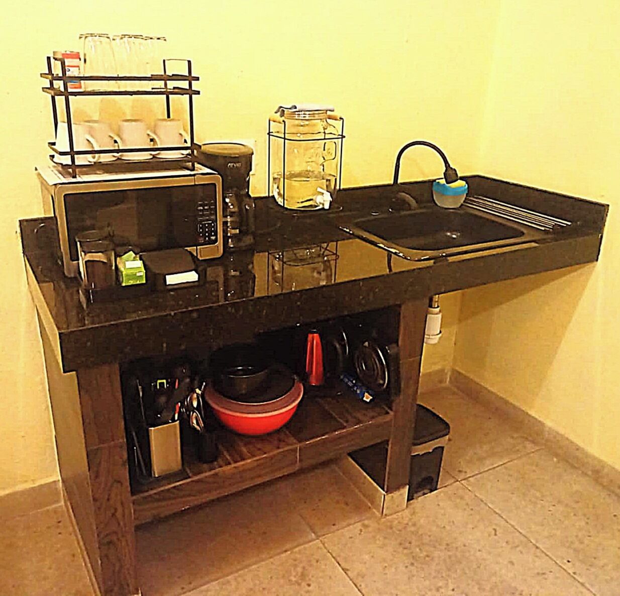 Coffee/tea maker, microwave, cookware/dishes/utensils, spices