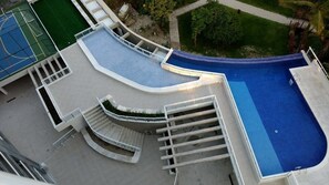Apartment | Pool | Outdoor pool, open 9:00 AM to 10:00 PM, pool umbrellas, sun loungers - M3 Riviera Inn Residence 84 (Bertioga)