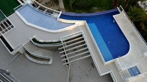 Apartment | Pool | Outdoor pool, open 9:00 AM to 10:00 PM, pool umbrellas, sun loungers - M3 Riviera Inn Residence 84 (Bertioga)