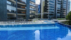 Apartment | Pool | Outdoor pool, open 9:00 AM to 10:00 PM, pool umbrellas, sun loungers - M3 Riviera Inn Residence 84 (Bertioga)