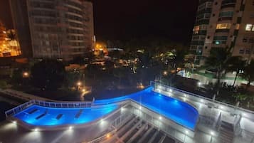 Outdoor pool, open 9:00 AM to 10:00 PM, pool umbrellas, pool loungers
