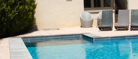 Seasonal outdoor pool, pool umbrellas, pool loungers
