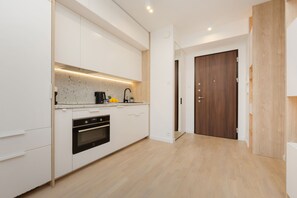 Studio, Kitchen | Private kitchen - Studio Mennica Residence by Renters Prestige (Warsaw)