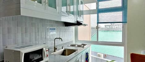 Condo | Private kitchen | Mini-fridge, cookware/dishes/utensils