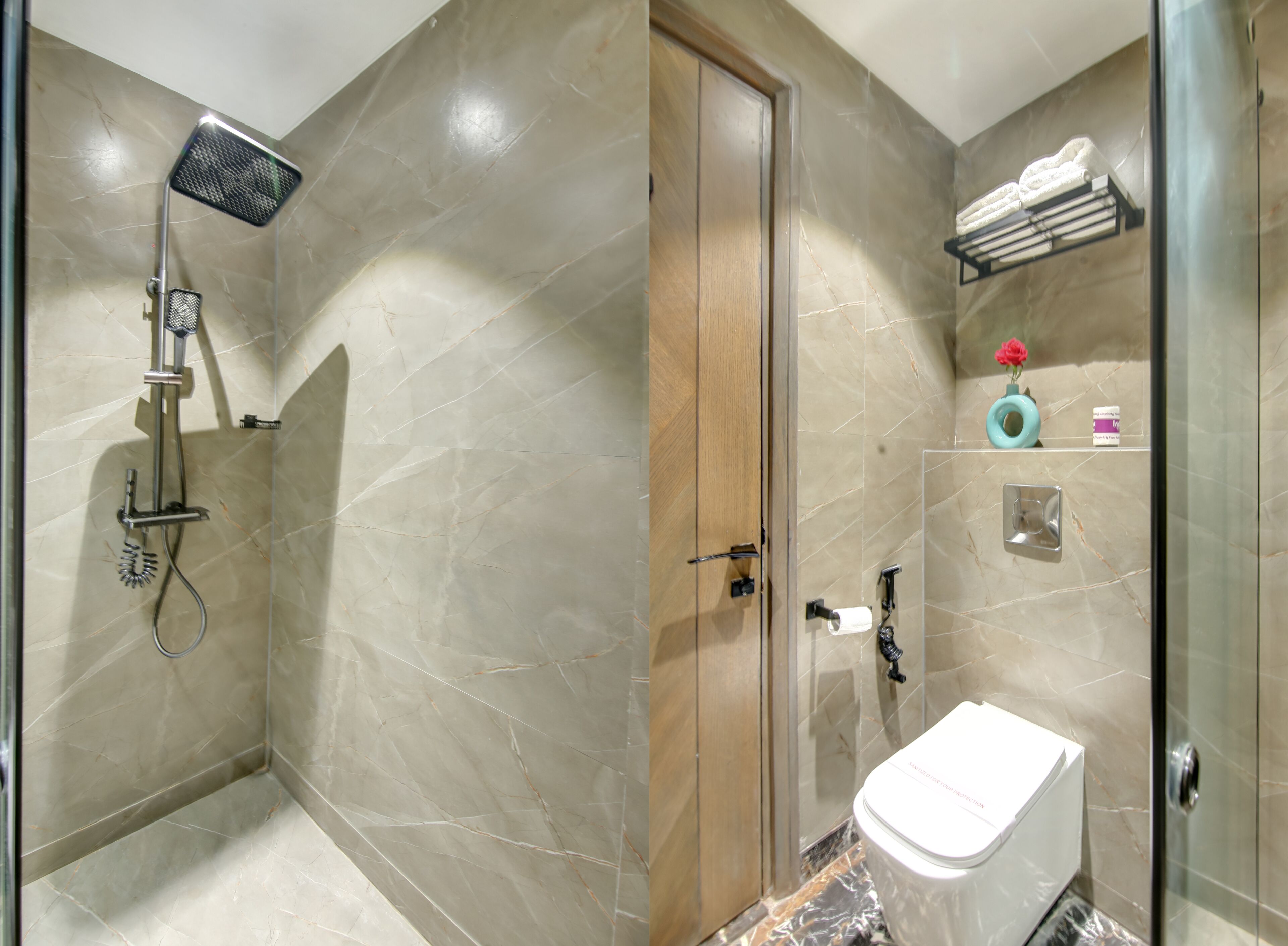 A bathroom with a shower, toilet, and a glass-enclosed shower area.