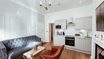 Luxury Apartment, 2 Bedrooms | Living area | 55-inch flat-screen TV with digital channels, fireplace