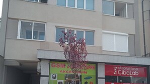 A multi-story building with a Samsung and Huawei advertisement on the ground floor. - 10 minutes walk to North Park, 5 minutes to Beli Dunav metro station.  (Sofia)