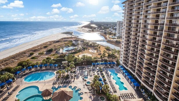 A resort with multiple swimming pools, a beach, and a high-rise building. - Paradise Found: Oceanfront 3-Bedroom Condo (North Myrtle Beach)