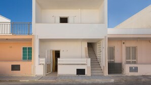 A two-story building with a staircase leading to the upper floor. - 3732 Le Dimore del Sole - PT by Barbarhouse (Trepuzzi)