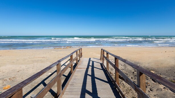 A wooden boardwalk leading to a beach with clear skies. - 3732 Le Dimore del Sole - PT by Barbarhouse (Trepuzzi)