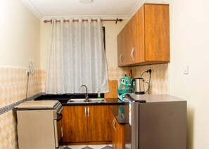 Apartment | Private kitchen | Fridge, microwave, oven, electric kettle - Spacious- Brb Homes Bukoto (Kampala)