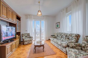 Family Apartment, Multiple Bedrooms, Mountainside (Zio Enry Terrace Apartment Orta Lake) | Living area | 21-inch flat-screen TV with cable channels, fireplace