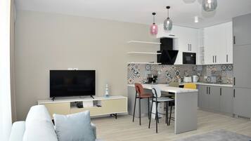 Standard Apartment, Multiple Bedrooms (White Moon Apartment 301) | Living area | 21-inch flat-screen TV with cable channels