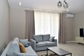 Standard Apartment, Multiple Bedrooms (White Moon Apartment 301) | Living area | 21-inch flat-screen TV with cable channels