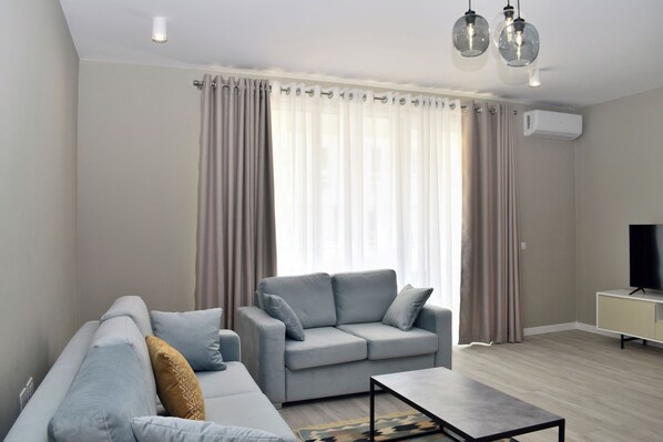 Standard Apartment, Multiple Bedrooms (White Moon Apartment 301) | Living area | 21-inch flat-screen TV with cable channels