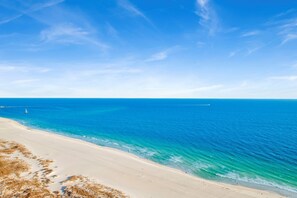 A beach with clear blue water and a sandy shore. - Escape to one of the Gulf Coast's premier destinations. Turquoise Place in Orange Beach, Alabama (Orange Beach)