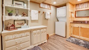 A compact kitchen with wooden cabinets, a built-in oven, and a small refrigerator. - Hayward Home w/ Private Deck, Fire Pit & Kayak! (Hayward)