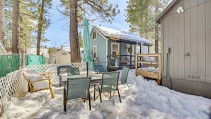 A backyard with a covered patio, outdoor furniture, and a shed. - Cozy Cabin w/ Deck - 2 Mi to Bear Mountain Resort! (Big Bear Lake)