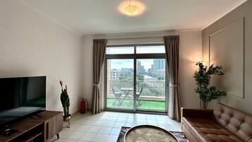 Panoramic Apartment | Living area | 60-inch Smart TV with digital channels, Netflix, streaming services