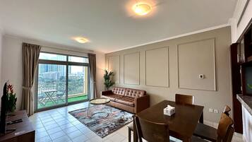 Panoramic Apartment | Living area | 60-inch Smart TV with digital channels, Netflix, streaming services